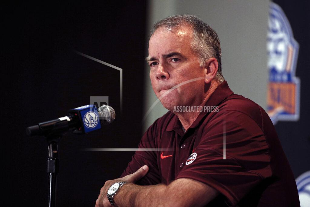 Nell Redmond Virginia Tech coach Mike Young answers a question during the Atlantic Coast Conference NCAA college basketball media day in Charlotte, N.C., Tuesday, Oct. 8, 2019. (AP Photo/Nell Redmond)