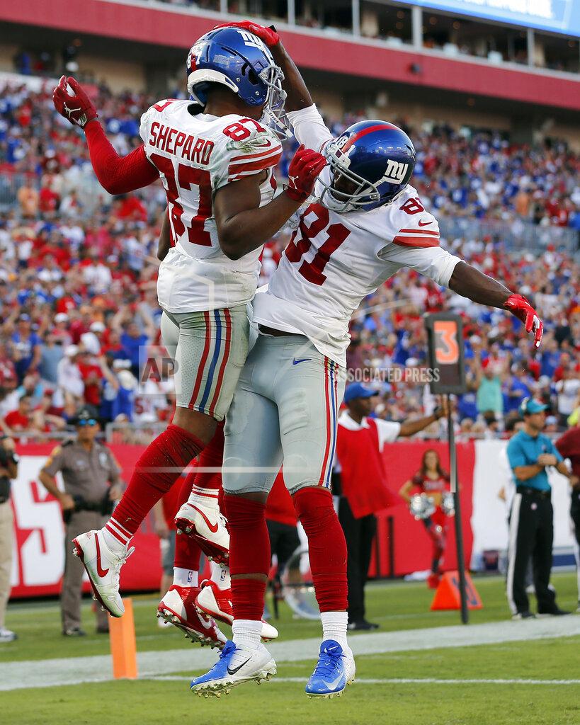 Mark Lomoglio New York Giants wide receiver Sterling Shepard (87) celebrates his touchdown against the Tampa Bay Buccaneers with wide receiver Russell Shepard (81) during the second half of an NFL football game Sunday, Sept. 22, 2019, in Tampa, Fla. (AP Photo/Mark LoMoglio)