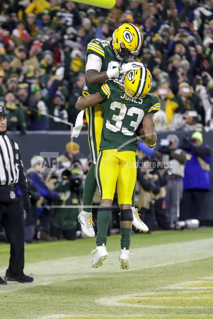 Darron Cummings Green Bay Packers' Aaron Jones celebrates his touchdown run with Geronimo Allison (81) during the first half of an NFL divisional playoff football game against the Seattle Seahawks Sunday, Jan. 12, 2020, in Green Bay, Wis. (AP Photo/Darron Cummings)