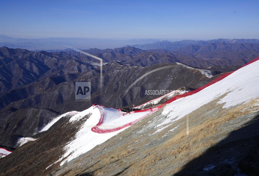 Luca Bruno The downhill course stands out from the almost snowless landscape ahead of the first men's downhill training run at the 2022 Winter Olympics, Thursday, Feb. 3, 2022, in the Yanqing district of Beijing. (AP Photo/Luca Bruno)