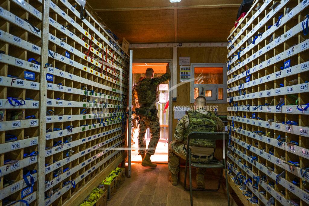 Uncredited Estonian Barkhane force soldiers man the entrance of the base in Gao, Mali Sunday June 6, 2021. French President Emmanuel Macron announced at a press conference Thursday June 10, 2021 That operation Barkhane would end and be replaced by support for local partners and counter terrorism. (AP Photo/Jerome Delay)