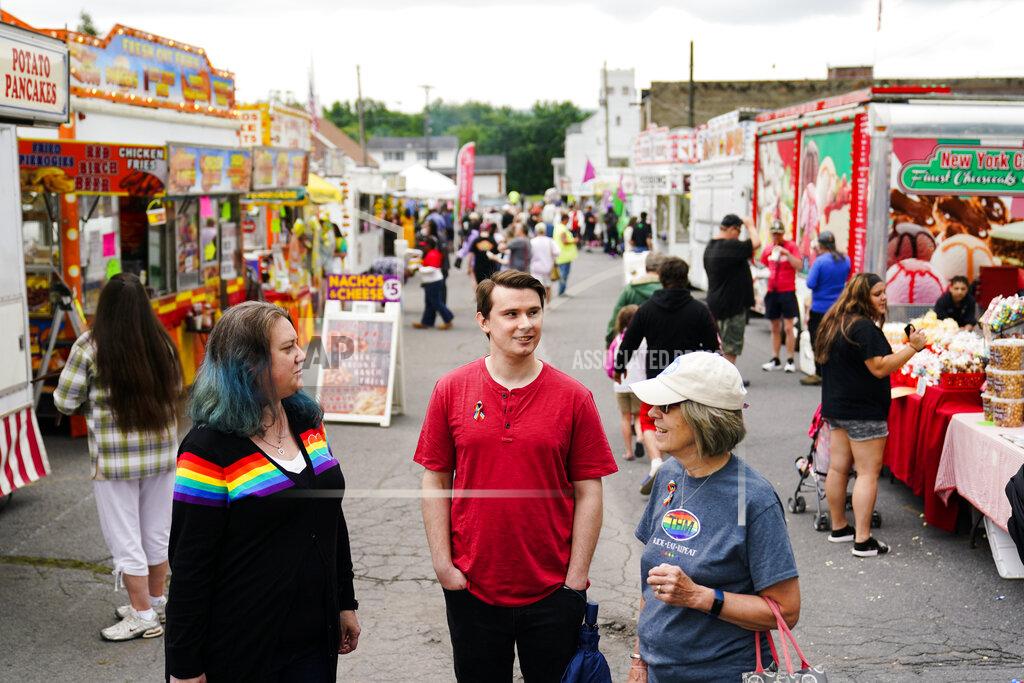 Matt Rourke Alisha Hoffman-Mirilovich, left, Mark Shaffer, and Claudia Glennan visit with on another at the Edwardsville Pierogi Festival in Edwardsville, Pa., Friday, June 11, 2021. (AP Photo/Matt Rourke)