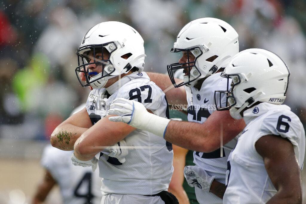 Al Goldis Penn State's Pat Freiermuth, left, Michal Menet, center, and Justin Shorter celebrate Freiermuth's touchdown on a pass reception against Michigan State during the second quarter of an NCAA college football game, Saturday, Oct. 26, 2019, in East Lansing, Mich. Penn State won 28-7. (AP Photo/Al Goldis)
