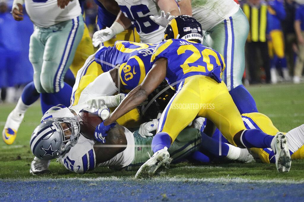 Marcio Jose Sanchez Dallas Cowboys running back Ezekiel Elliott scores against the Los Angeles Rams during the second half in an NFL divisional football playoff game Saturday, Jan. 12, 2019, in Los Angeles. (AP Photo/Marcio Jose Sanchez)
