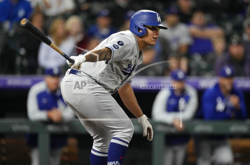 David Zalubowski Los Angeles Dodgers' Julio Urias follows the flight of his RBI-single in the fifth inning of a baseball game Tuesday, Sept. 21, 2021, in Denver. (AP Photo/David Zalubowski)