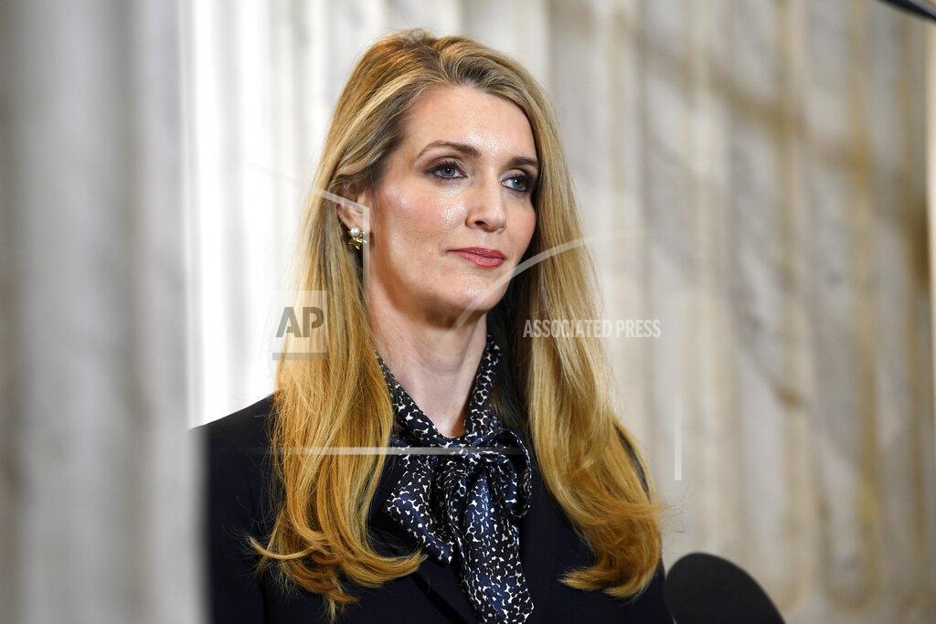 Susan Walsh FILE - In this March 20, 2020, file photo, U.S. Sen. Kelly Loeffler, R-Georgia, waits to speak in a television interview on Capitol Hill in Washington. Candidates in the special election for the U.S. Senate seat held by Loeffler are set to square off in their first debate Monday, Oct. 19, 2020. Loeffler faces a large field including Democrat Raphael Warnock and fellow Republican Doug Collins in a race for the seat she was appointed to 10 months earlier. (AP Photo/Susan Walsh, File)