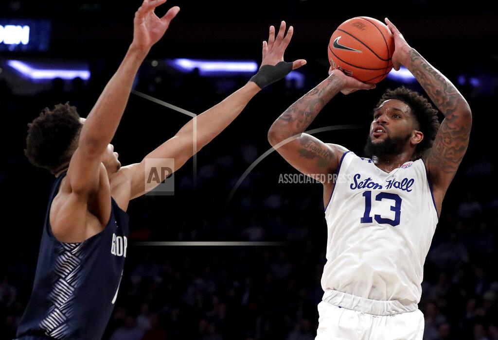 Julio Cortez Seton Hall guard Myles Powell (13) shoots against Georgetown guard Jamorko Pickett during the first half of an NCAA college basketball game in the Big East men's tournament, Thursday, March 14, 2019, in New York. (AP Photo/Julio Cortez)