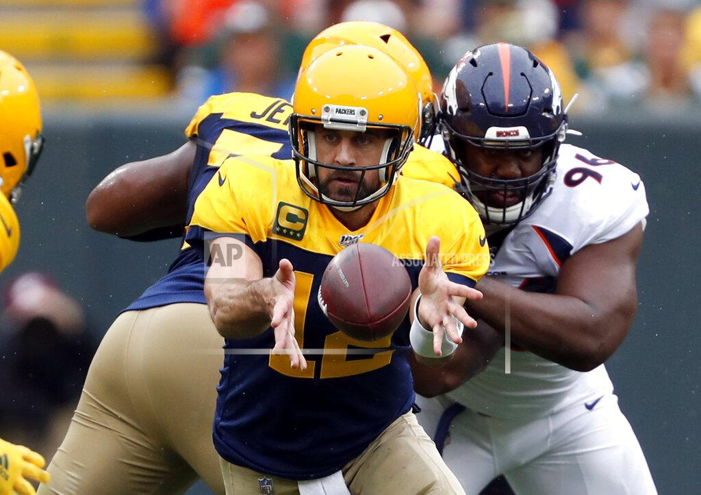 Matt Ludtke Green Bay Packers quarterback Aaron Rodgers pitches the ball to running back Aaron Jones during the first half of an NFL football game against the Denver Broncos Sunday, Sept. 22, 2019, in Green Bay, Wis. (AP Photo/Matt Ludtke)