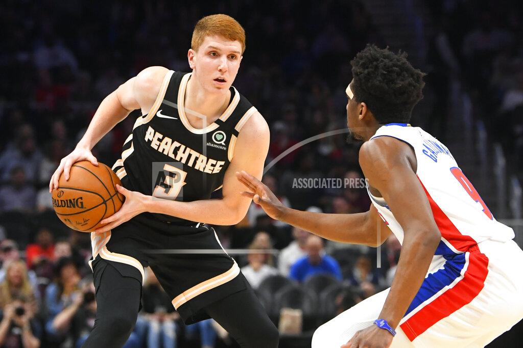 John Amis Atlanta Hawks guard Kevin Huerter (3) is defended by Detroit Pistons guard Langston Galloway during the first half of an NBA basketball game Saturday, Jan. 18, 2020, in Atlanta. (AP Photo/John Amis)
