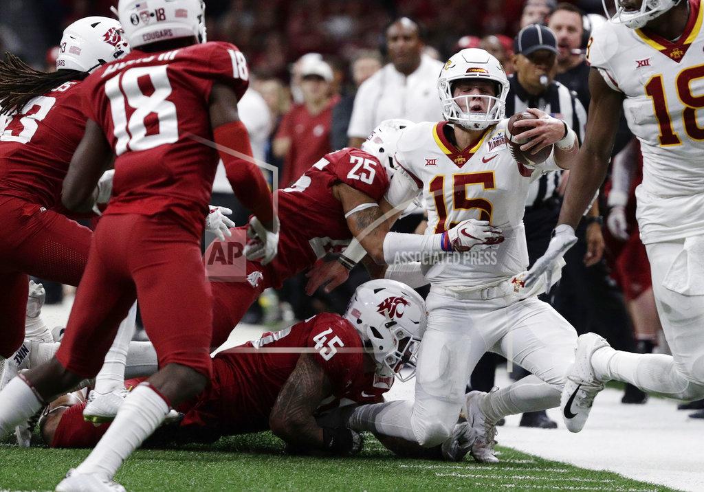 Eric Gay Iowa State quarterback Brock Purdy (15) is stopped short of a first down by Washington State defenders Skyler Thomas (25) and Logan Tago (45) during the second half of the Alamo Bowl NCAA college football game Friday, Dec. 28, 2018, in San Antonio. (AP Photo/Eric Gay)