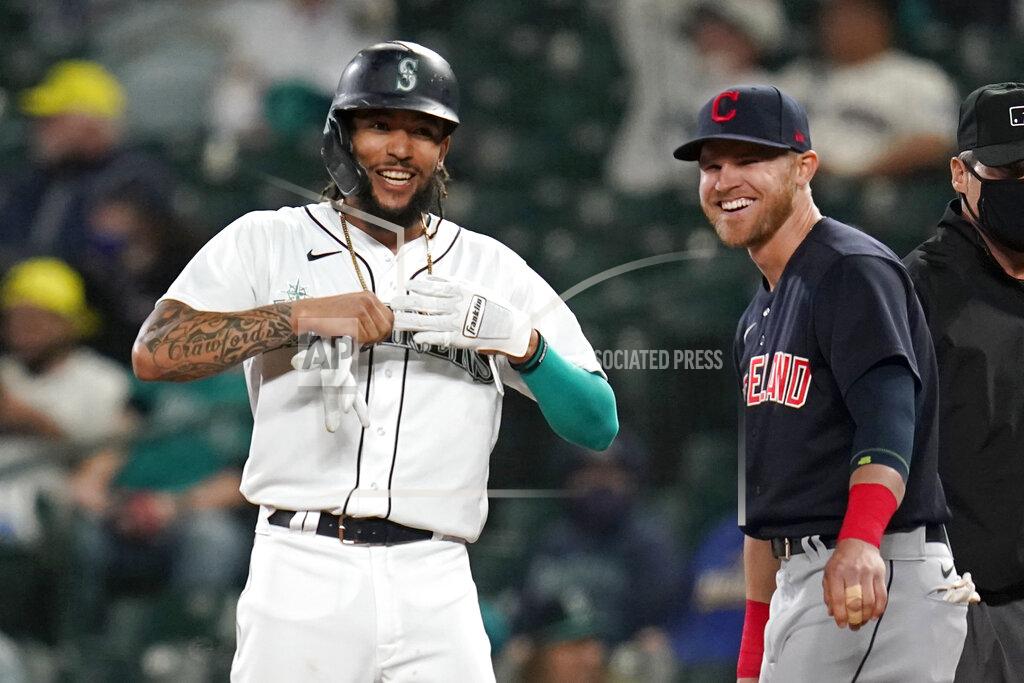Elaine Thompson Seattle Mariners' J.P. Crawford, left, and Cleveland Indians first baseman Jake Bauers smile as they stand at first base after Crawford's single during the eighth inning of a baseball game Thursday, May 13, 2021, in Seattle. The hit was the first of the evening for the Mariners. (AP Photo/Elaine Thompson)