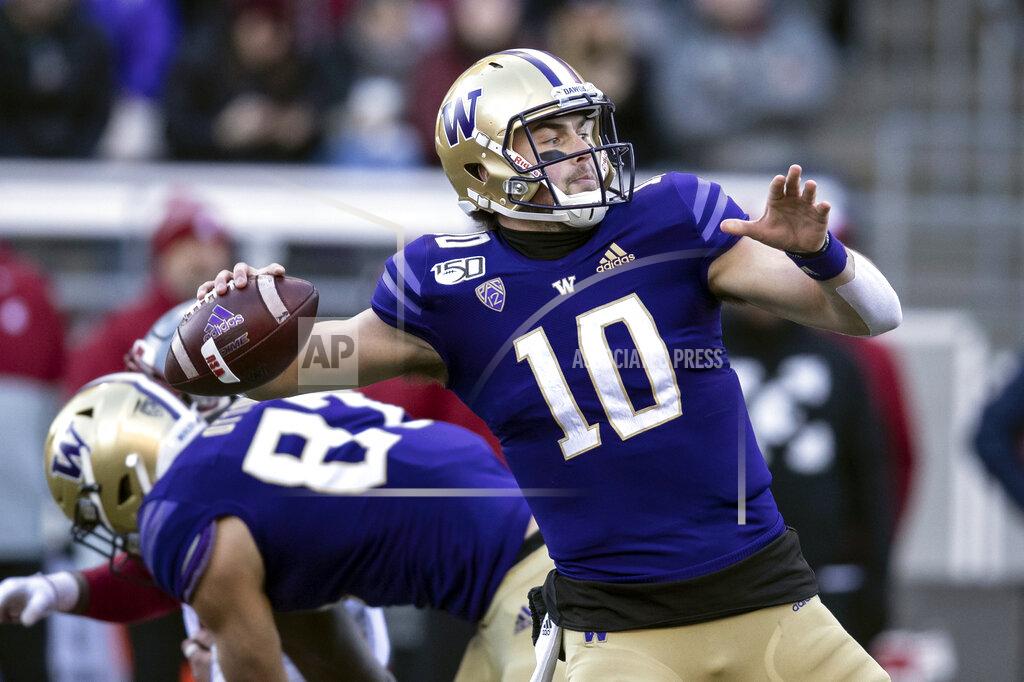 Stephen Brashear FILE - In this Nov. 29, 2019, file photo, Washington quarterback Jacob Eason throws a pass during the first half of an NCAA college football game against Washington State in Seattle. Ohio. The Indianapolis Colts selected Eason in the fourth round of the NFL football draft on Saturday, April 25, 2020. (AP Photo/Stephen Brashear, File)