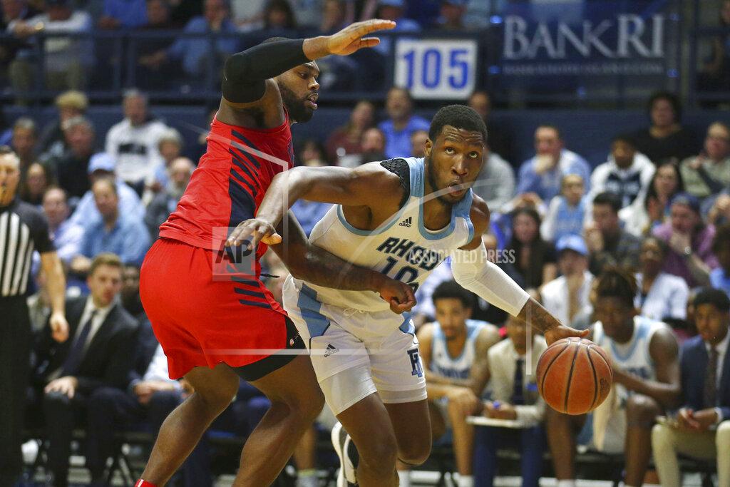 Stew Milne Rhode Island's Cyril Langevine (10) drives to the basket against the defense of Dayton's Trey Landers (3) of an NCAA college basketball game Wednesday, March 4, 2020, in Kingston, R.I. (AP Photo/Stew Milne)