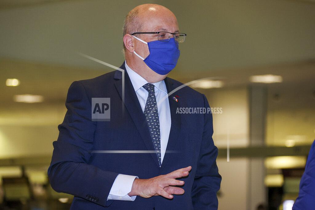 David Gray France's Ambassador to Australia Jean-Pierre Thebault gestures as he arrives at Sydney Airport, Saturday, Sept. 18, 2021. Thebault has described as a "huge mistake" Australia's surprise cancellation of a major submarine contract in favor of a U.S. deal, in an unprecedented show of anger among the allies. (AP Photo/David Gray)