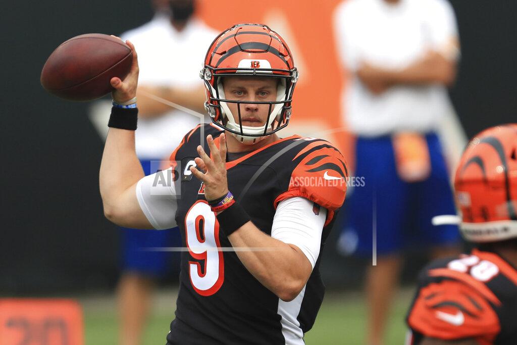 Aaron Doster FILE - Cincinnati Bengals quarterback Joe Burrow (9) throws during the first half of an NFL football game against the Los Angeles Chargers, Sunday, Sept. 13, 2020, in Cincinnati. This year's No. 1 overall draft pick, reigning Heisman Trophy winner and just maybe the quarterback to change Cincinnati's fortunes, makes his first road start as the Bengals visit the Cleveland Browns to renew a rivalry Burrow learned about as a youngster. (AP Photo/Aaron Doster, File)