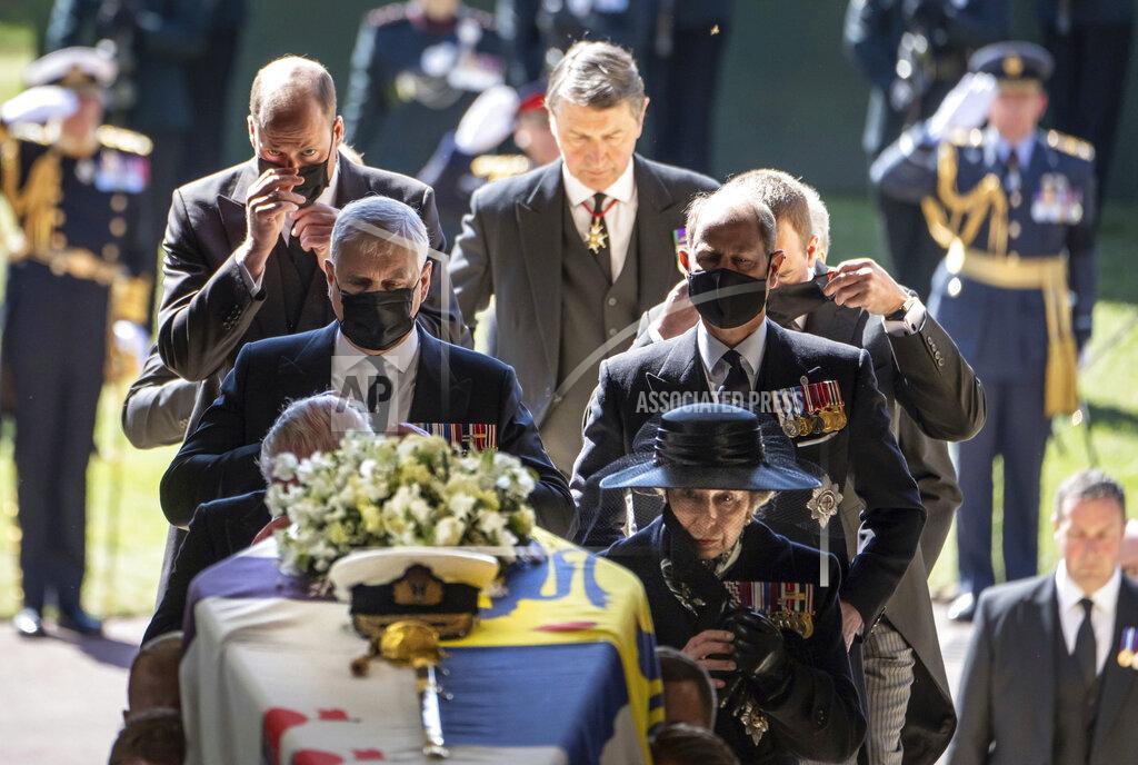 Danny Lawson Pall Bearers carry the coffin of the Duke of Edinburgh into St George's Chapel for his funeral, as members of the royal family including Princess Anne, right, Prince Andrew, Prince Edward, Prince William and Sir Tim Laurence follow, at Windsor Castle, in Windsor, England, Saturday April 17, 2021. Prince Philip died April 9 at the age of 99 after 73 years of marriage to Britain's Queen Elizabeth II. (Danny Lawson/Pool via AP)