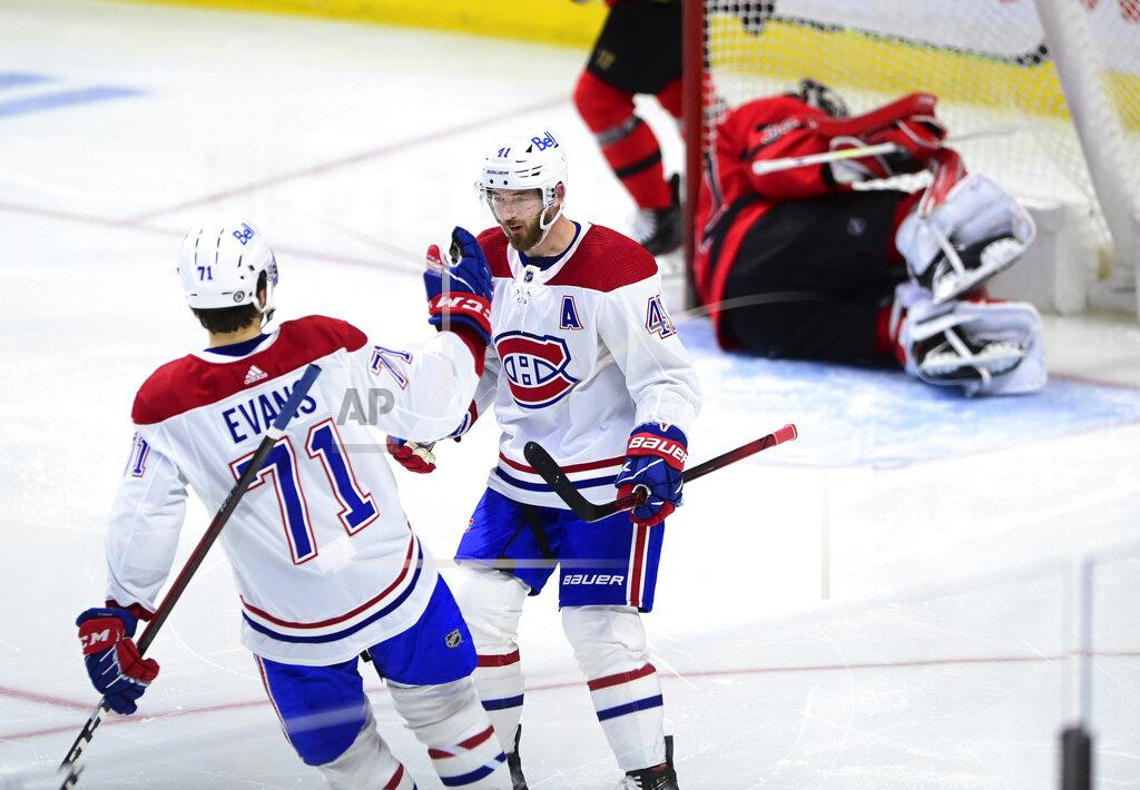 Sean Kilpatrick Montreal Canadiens' Paul Byron (41) celebrates a shorthanded goal on Ottawa Senators goalie Filip Gustavsson (32) with teammate Jake Evans (71) during the second period of an NHL hockey game Thursday, April 1, 2021, in Ottawa, Ontario. (Sean Kilpatrick/The Canadian Press via AP)