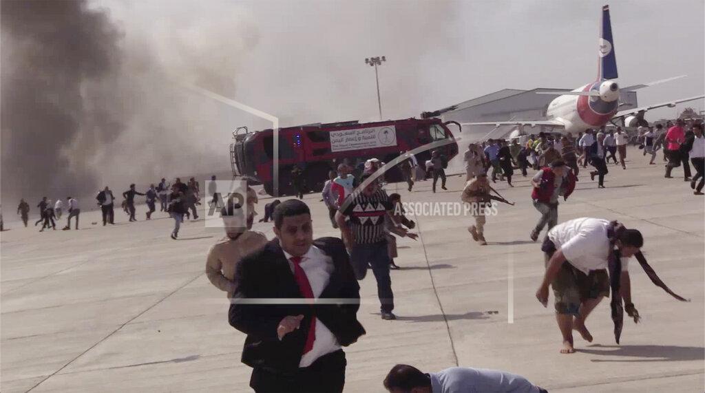 Uncredited FILE - In this Dec. 30, 2020 file photo, people run following an explosion at the airport in Aden, Yemen, shortly after a plane carrying the newly formed Cabinet landed. Yemen’s war began in September 2014, when the Houthis seized the capital Sanaa. Saudi Arabia, along with the United Arab Emirates and other countries, entered the war alongside Yemen’s internationally recognized government in March 2015. The war has killed some 130,000 people and driven the Arab world’s poorest country to the brink of famine. (AP Photo, File)