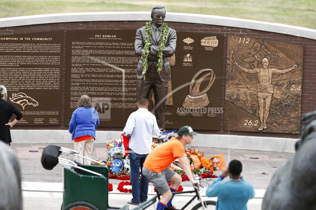 David Zalubowski Fans gather at the foot of a statue at a five-hour memorial Denver Broncos owner Pat Bowlen Tuesday, June 18, 2019 in at Mile High Stadium, the NFL football team's home in Denver. Bowlen, who has owned the franchise for more than three decades, died last Thursday. (AP Photo/David Zalubowski)