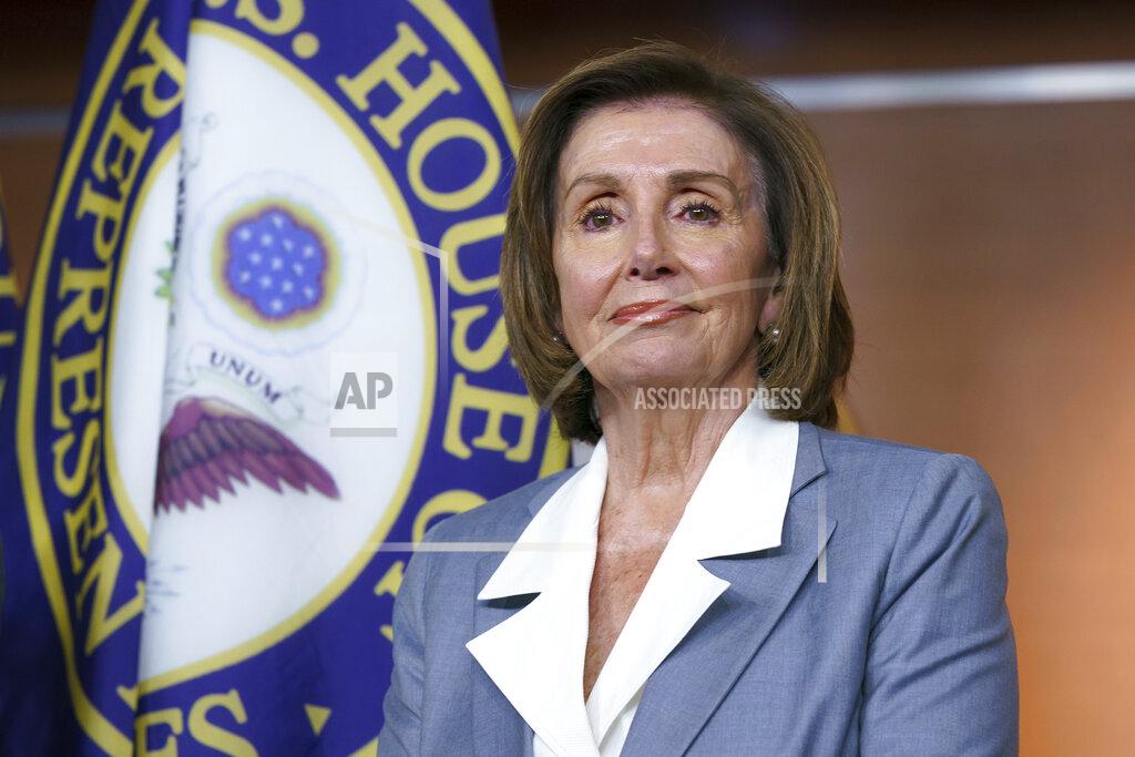 J. Scott Applewhite FILE - In this June 30, 2021 file photo, Speaker of the House Nancy Pelosi, D-Calif., listens at a news conference as the House prepares to vote on the creation of a select committee to investigate the Jan. 6 insurrection, at the Capitol in Washington. Pelosi is rejecting two Republicans tapped by House GOP Leader Kevin McCarthy to sit on a committee investigating the Jan. 6 Capitol insurrection. She cited the “integrity” of the investigation. Pelosi said in a statement Wednesday that she would not accept the appointments of Indiana Rep. Jim Banks, whom McCarthy picked to be the top Republican on the panel, or Ohio Rep. Jim Jordan. Both are close allies of former President Donald Trump. (AP Photo/J. Scott Applewhite)