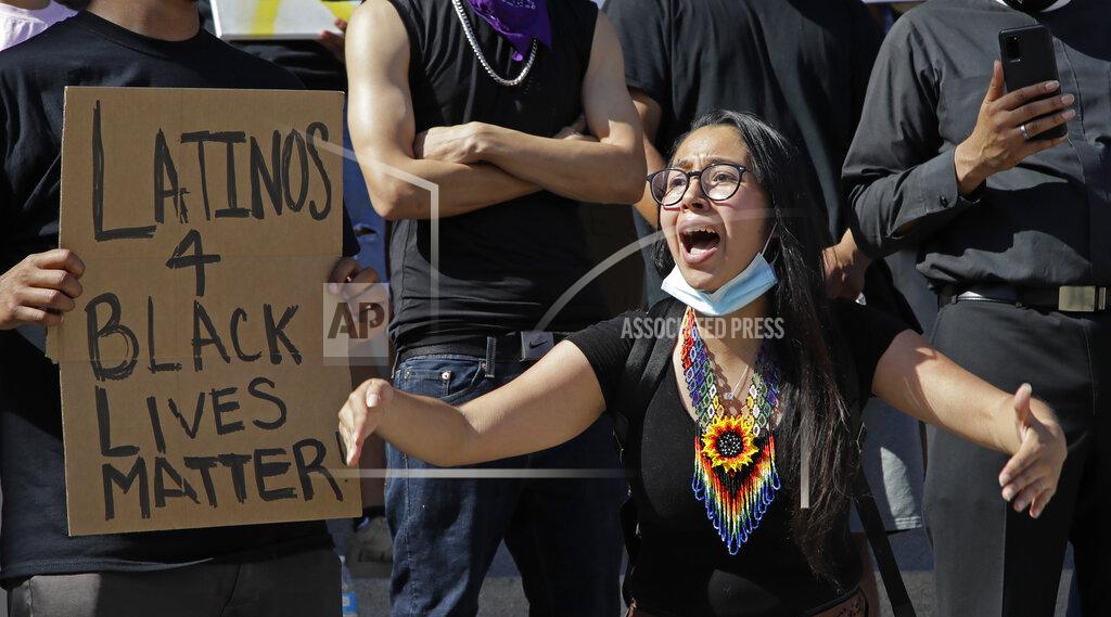 Ben Margot A woman gestures while speaking during a protest Tuesday, June 2, 2020, in Redwood City, Calif. (AP Photo/Ben Margot)