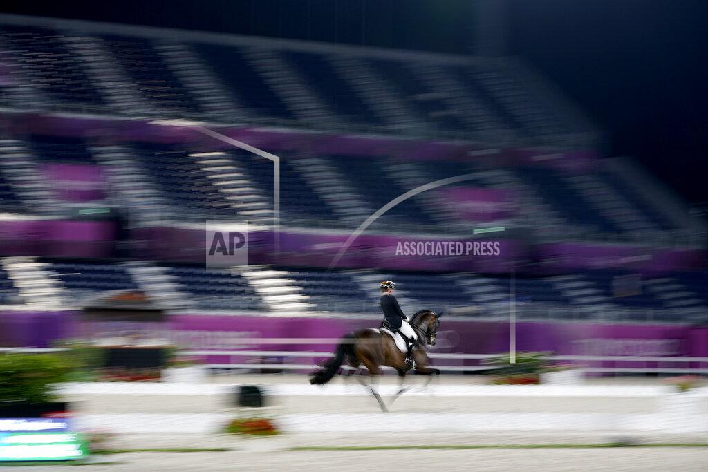 David Goldman Germany's Dorothee Schneider, riding Showtime FRH, competes in the equestrian dressage individual final at the 2020 Summer Olympics, Wednesday, July 28, 2021, in Tokyo. (AP Photo/David Goldman)