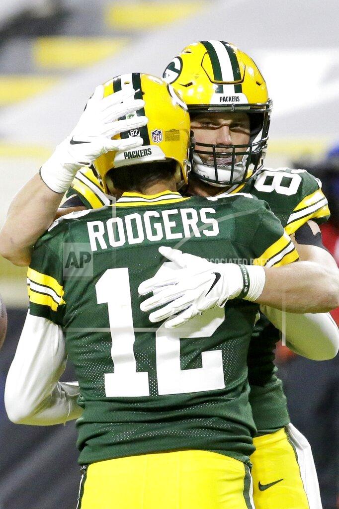 Mike Roemer Green Bay Packers' Robert Tonyan celebrates his touchdown catch with Aaron Rodgers (12) during the second half of an NFL football game against the Chicago Bears Sunday, Nov. 29, 2020, in Green Bay, Wis. (AP Photo/Mike Roemer)