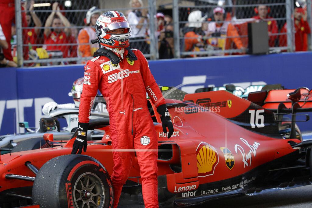 Luca Bruno Ferrari driver Charles Leclerc of Monaco steers his racer celebrates after setting the pole position at the end of the qualifying session practice at the 'Sochi Autodrom' Formula One circuit, in Sochi, Russia, Saturday, Sept.28, 2019. The Formula one race will be held on Sunday. (AP Photo/Luca Bruno)