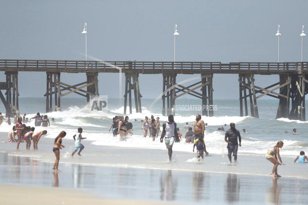 Stephen M. Dowell Daytona Beach, Fla., is crowded with beachgoers Saturday, Aug. 1, 2020. Isaias is expected to regain hurricane strength before reaching Florida. (Stephen M. Dowell/Orlando Sentinel via AP)