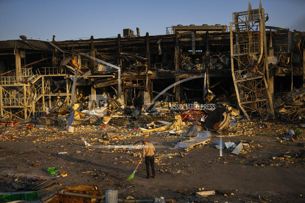 Francisco Seco A man sweeps rubble next to a shopping and entertainment mall destroyed after a Russian missiles strike on May 9, in Odessa, Ukraine, Friday, May 13, 2022. (AP Photo/Francisco Seco)