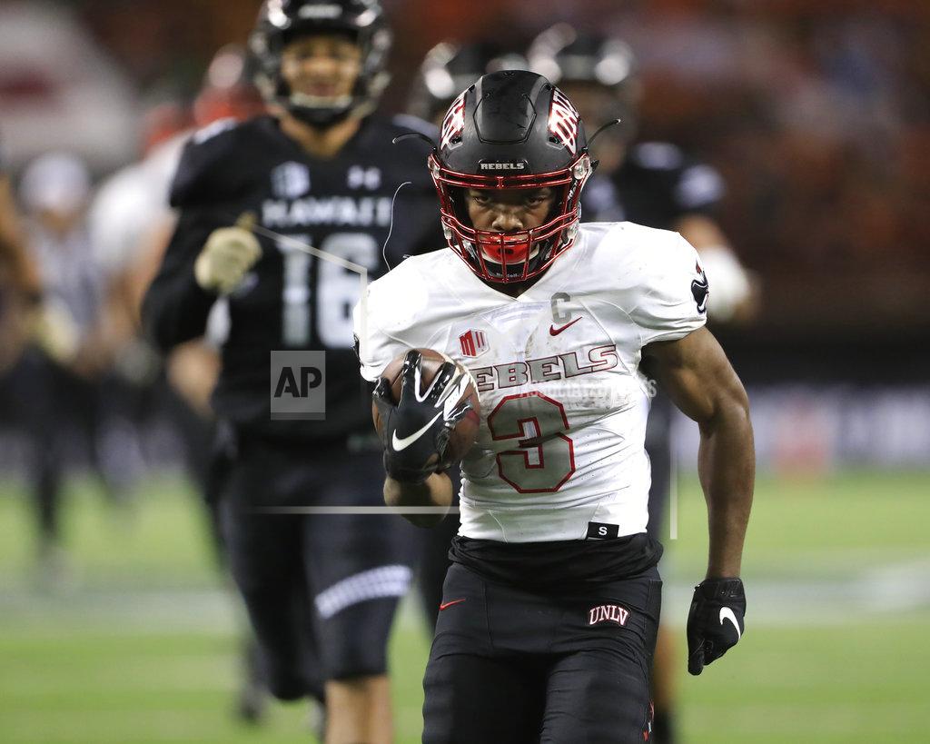 Marco Garcia UNLV running back Lexington Thomas (3) runs the ball into the end zone during the second quarter of an NCAA college football game against Hawaii, Saturday, Nov. 17, 2018, in Honolulu. (AP Photo/Marco Garcia)