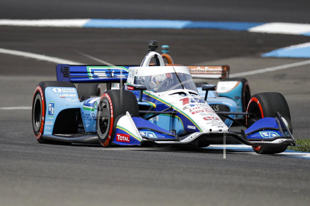 Darron Cummings Race driver Graham Rahal drives though a turn during the IndyCar auto race at Indianapolis Motor Speedway in Indianapolis, Saturday, July 4, 2020. (AP Photo/Darron Cummings)
