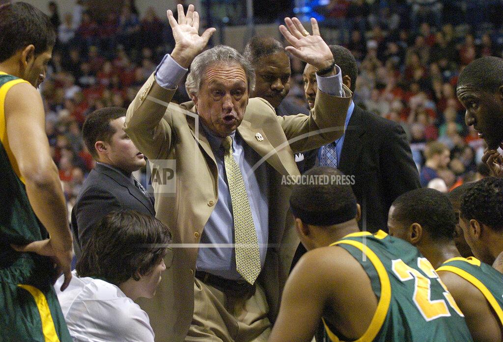 Ingrid Barrentine FILE - In this Monday, Jan. 21, 2008, file photo, San Francisco basketball coach Eddie Sutton talks with his team in the first half of an NCAA college basketball game against Gonzaga, in Spokane, Wash. Sutton, the Hall of Fame basketball coach who led three teams to the Final Four and was the first coach to take four schools to the NCAA Tournament, died Saturday, May 23, 2020. He was 84. (AP Photo/Ingrid Barrentine, File)