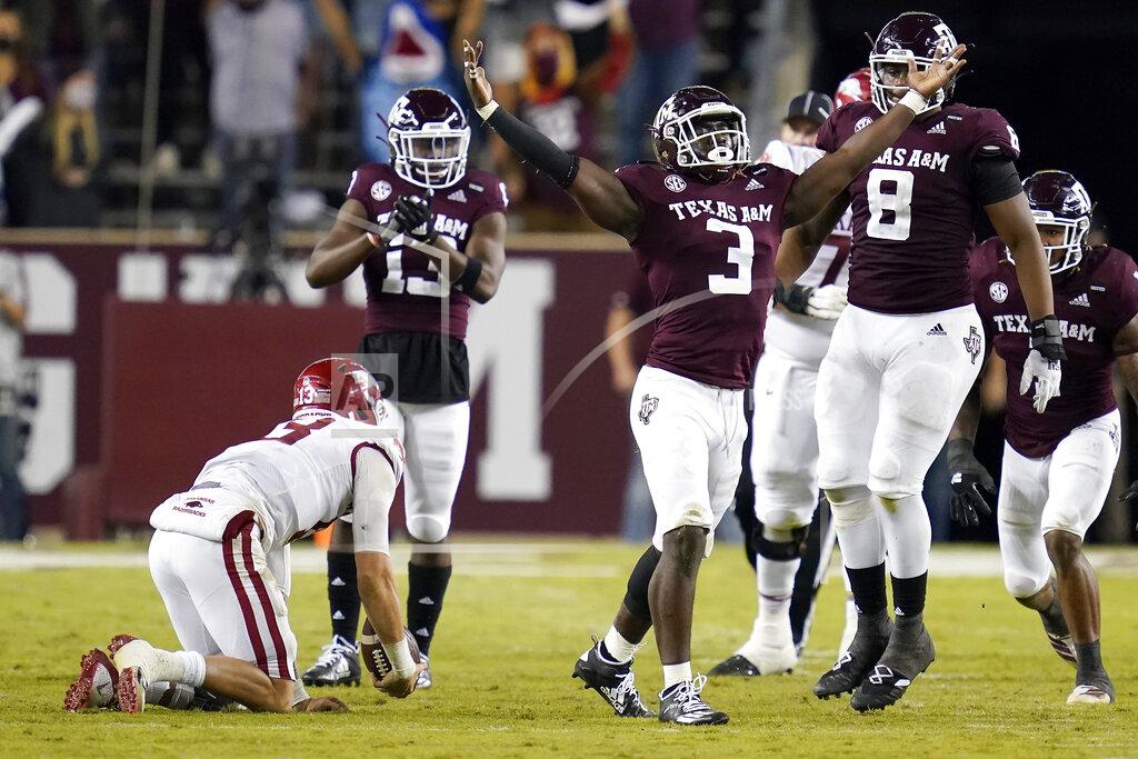 Sam Craft Texas A&M defensive lineman Tyree Johnson (3) reacts after sacking Arkansas quarterback Feleipe Franks (13) during the second quarter of an NCAA college football game, Saturday, Oct. 31, 2020, in College Station, Texas. (AP Photo/Sam Craft)