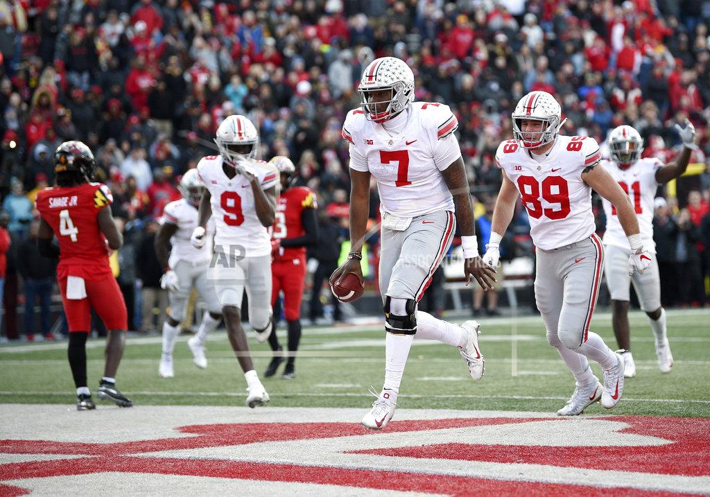 Nick Wass Ohio State quarterback Dwayne Haskins Jr. (7) celebrates his touchdown next to tight end Luke Farrell (89) and wide receiver Binjimen Victor (9) during the overtime of an NCAA football game as Maryland defensive back Darnell Savage Jr. (4) looks on at left, Saturday, Nov. 17, 2018, in College Park, Md. Ohio State won 52-51. (AP Photo/Nick Wass)