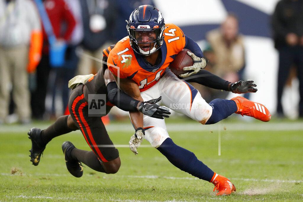 David Zalubowski Denver Broncos wide receiver Courtland Sutton (14) is hit by Cleveland Browns cornerback Denzel Ward during the second half of NFL football game Sunday, Nov. 3, 2019, in Denver. (AP Photo/David Zalubowski)