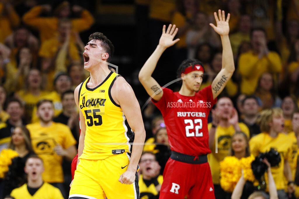 Charlie Neibergall Iowa center Luka Garza celebrates in front of Rutgers guard Caleb McConnell (22) after making a basket during the first half of an NCAA college basketball game, Wednesday, Jan. 22, 2020, in Iowa City, Iowa. (AP Photo/Charlie Neibergall)