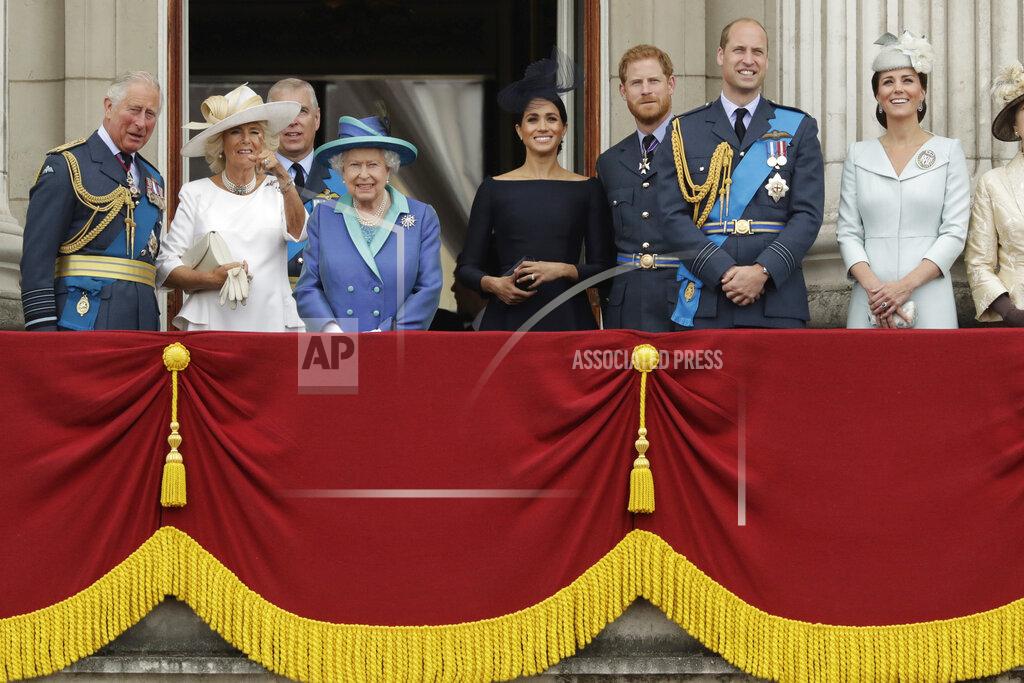 Matt Dunham FILE - In this Tuesday, July 10, 2018 file photo, members of THE royal family gather on the balcony of Buckingham Palace, with from left, Britain's Prince Charles, Camilla the Duchess of Cornwall, Prince Andrew, Queen Elizabeth II, Meghan the Duchess of Sussex, Prince Harry, Prince William and Kate the Duchess of Cambridge, as they watch a flypast of Royal Air Force aircraft pass over Buckingham Palace in London. The timing couldn’t be worse for Harry and Meghan. The Duke and Duchess of Sussex will finally get the chance to tell the story behind their departure from royal duties directly to the public on Sunday, March 7, 2021 when their two-hour interview with Oprah Winfrey is broadcast. (AP Photo/Matt Dunham, File)