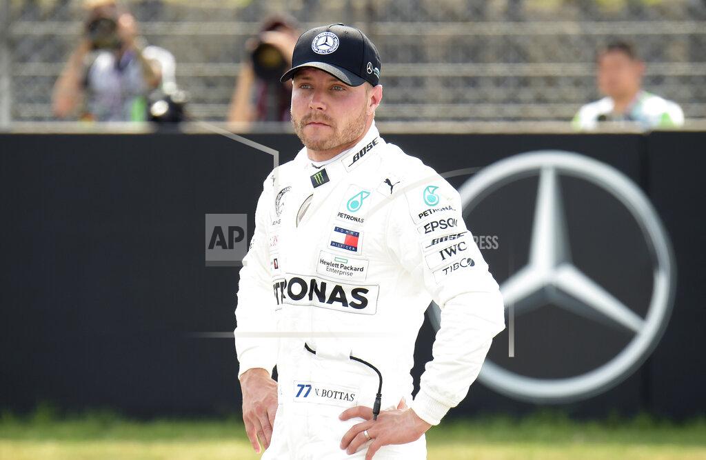 Jens Meyer FILE - In this file photo dated Saturday, July 27, 2019, Mercedes driver Valtteri Bottas of Finland stands after he clocked the third fastest time during the qualifying Formula One session at the Hockenheimring racetrack in Hockenheim, Germany. Mercedes has a point to prove at upcoming weekend’s Hungarian Grand Prix, especially Valtteri Bottas.(AP Photo/Jens Meyer, FILE)