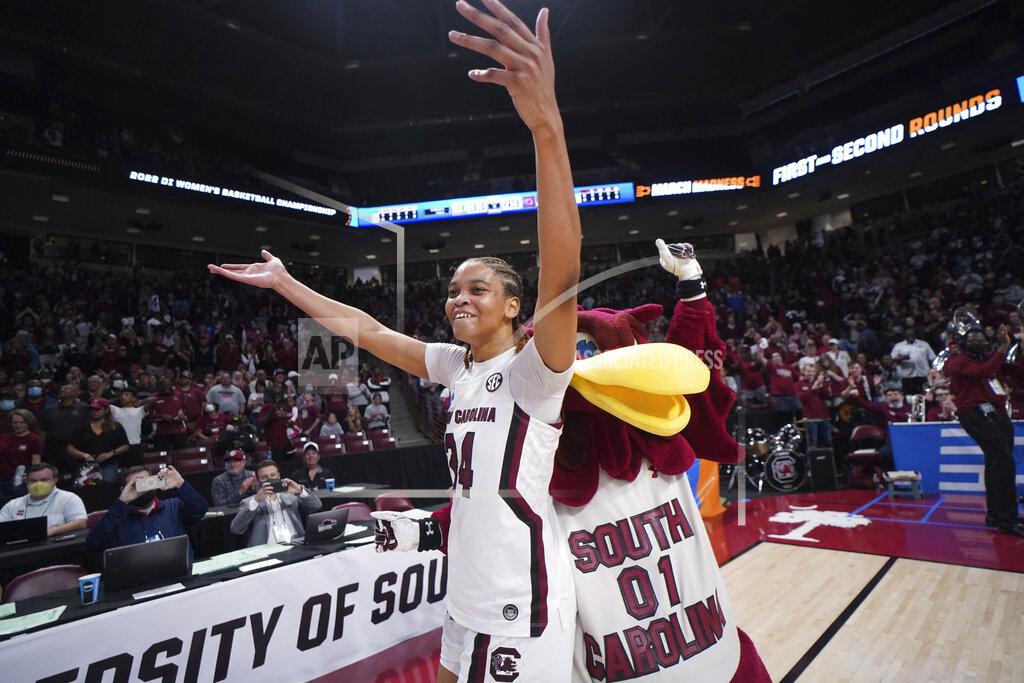 Sean Rayford South Carolina guard LeLe Grissett celebrates with Cocky after a second-round game against Miami in the NCAA college basketball tournament Sunday, March 20, 2022 in Columbia, S.C. South Carolina won 49-33. (AP Photo/Sean Rayford)