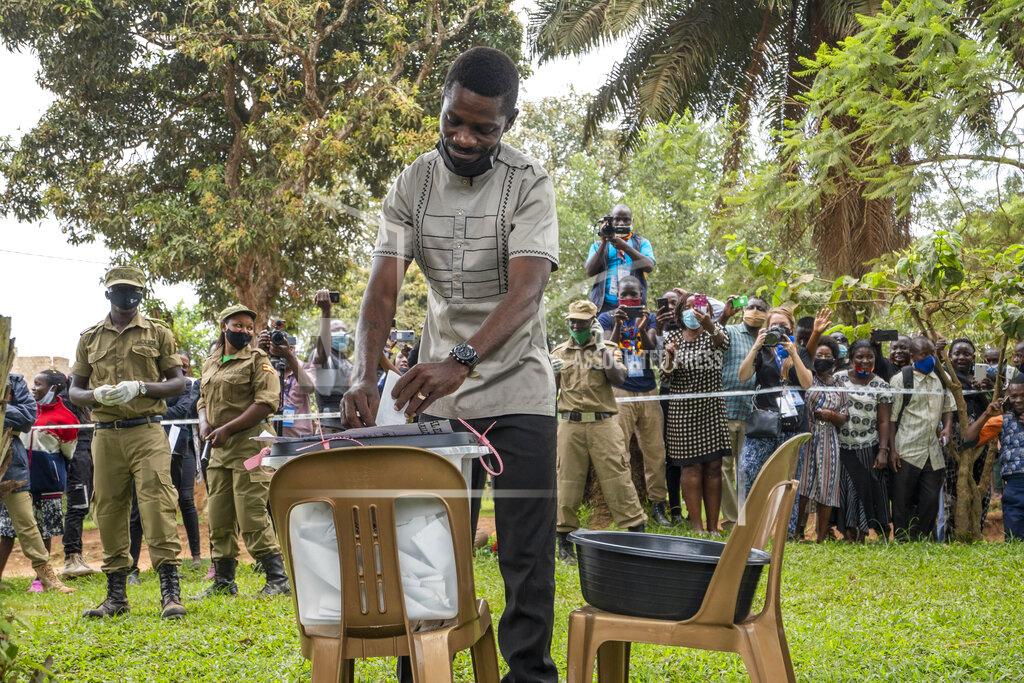 Jerome Delay Uganda's leading opposition challenger Bobi Wine votes in Kampala, Uganda, Thursday, Jan. 14, 2021. Ugandans are voting in a presidential election tainted by widespread violence that some fear could escalate as security forces try to stop supporters of Wine from monitoring polling stations.(AP Photo/Jerome Delay)