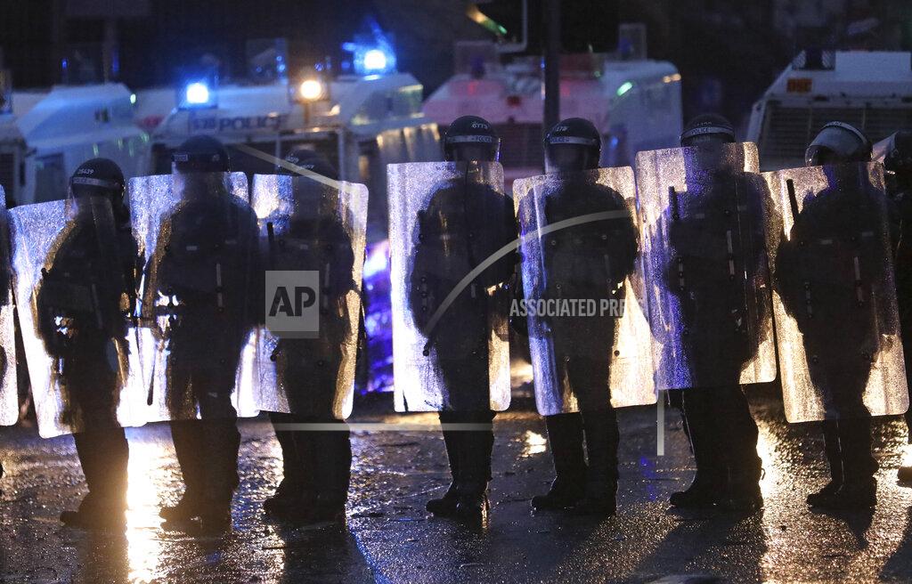 Peter Morrison Police block a road near the Peace Wall in West Belfast, Northern Ireland, Thursday, April 8, 2021. Authorities in Northern Ireland sought to restore calm Thursday after Protestant and Catholic youths in Belfast hurled bricks, fireworks and gasoline bombs at police and each other. It was the worst mayhem in a week of street violence in the region, where Britain's exit from the European Union has unsettled an uneasy political balance. (AP Photo/Peter Morrison)