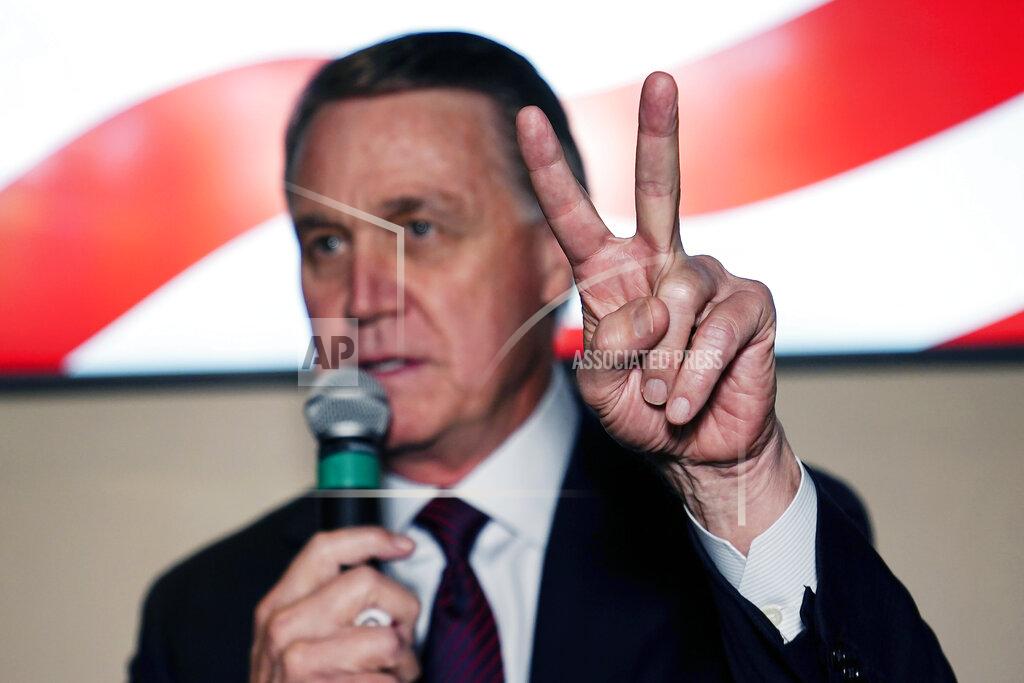 Brynn Anderson Republican candidate for U.S. Senate Sen. David Perdue speaks during a campaign rally on Friday, Nov. 13, 2020, in Cumming, Ga. Perdue and Democratic candidate Jon Ossoff are in a runoff election for the Senate seat in Georgia. (AP Photo/Brynn Anderson)