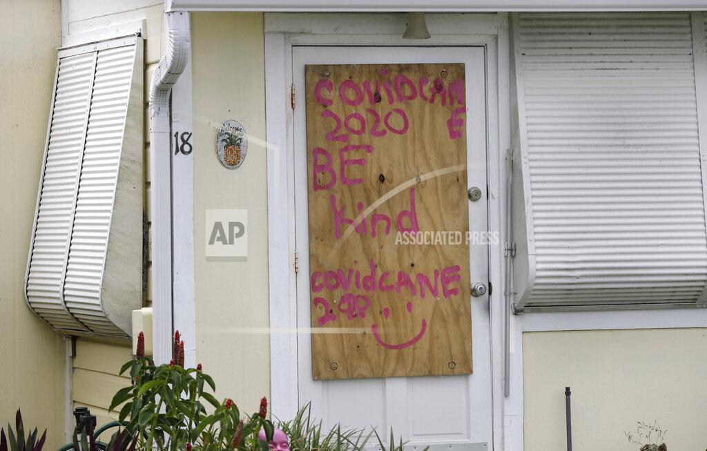 Wilfredo Lee A boarded up home is shown, Saturday, Aug. 1, 2020, in Briny Breezes, Fla. Hurricane Isaias has snapped trees and knocked out power while blowing through the Bahamas on Saturday. It's headed toward the Florida coast, where officials have closed beaches, parks and coronavirus testing sites. (AP Photo/Wilfredo Lee)