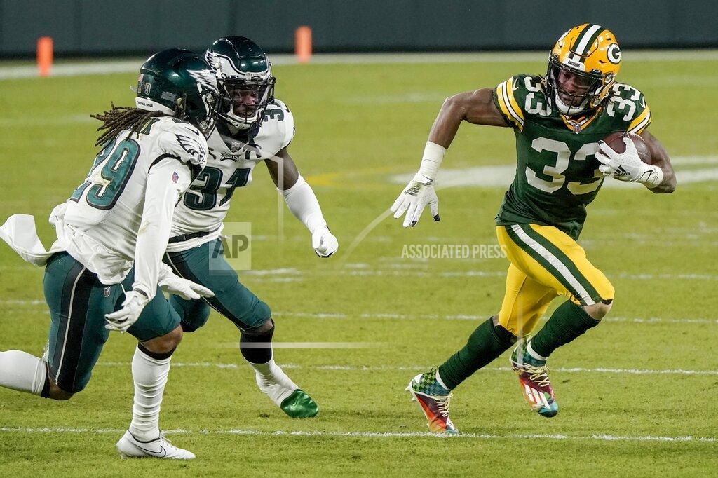 Morry Gash Green Bay Packers' Aaron Jones runs during the second half of an NFL football game against the Philadelphia Eagles Sunday, Dec. 6, 2020, in Green Bay, Wis. (AP Photo/Morry Gash)