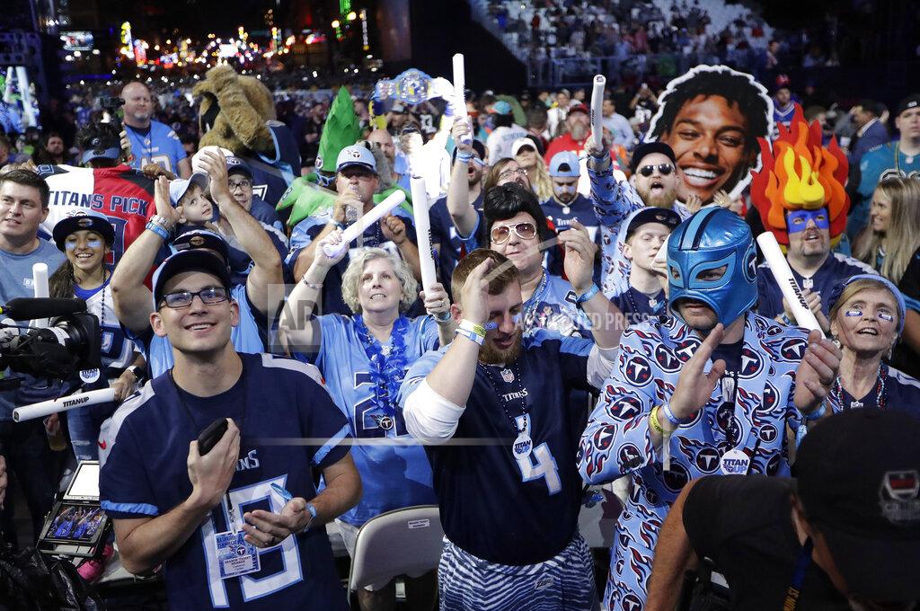 Fans watch the action on the main stage during the first round at the NFL football draft, Thursday, April 25, 2019, in Nashville, Tenn. (AP Photo/Mark Humphrey)