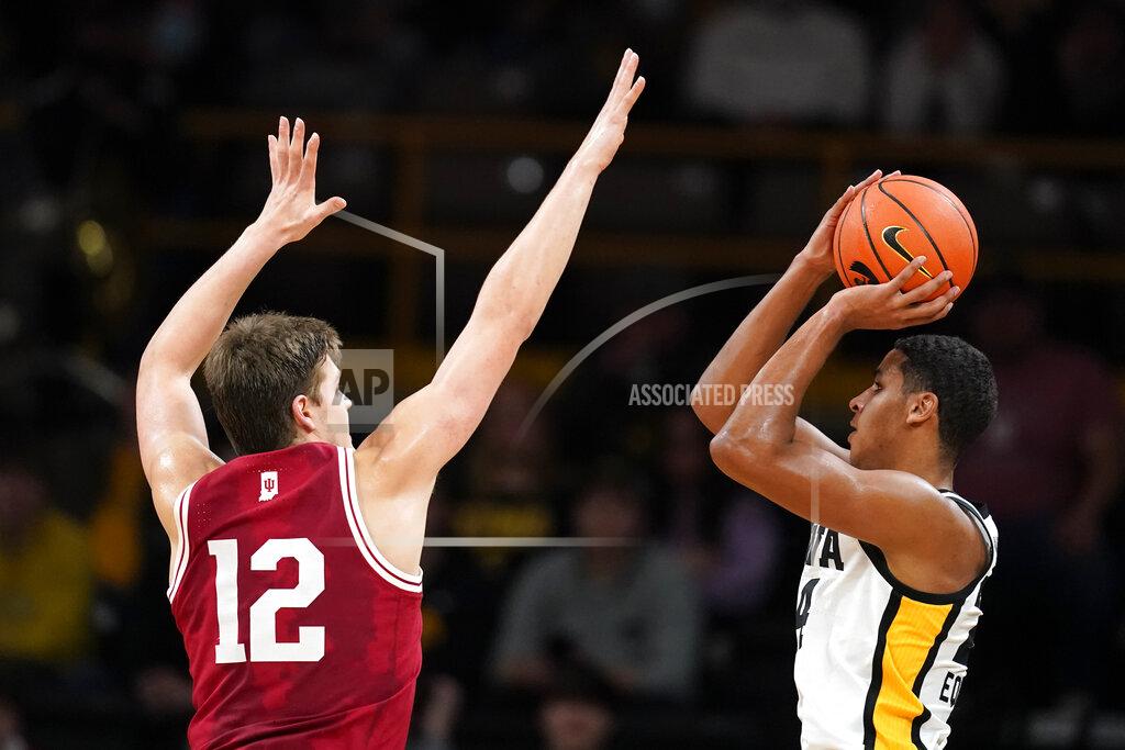 Charlie Neibergall Iowa forward Kris Murray shoots over Indiana forward Miller Kopp (12) during the first half of an NCAA college basketball game, Thursday, Jan. 13, 2022, in Iowa City, Iowa. (AP Photo/Charlie Neibergall)