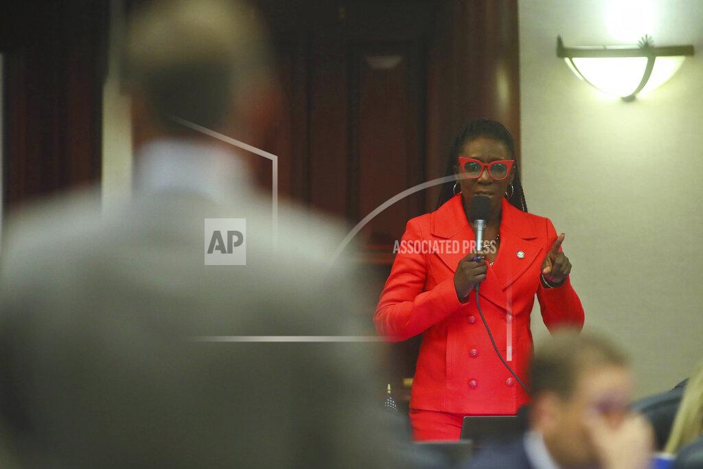 Phil Sears At right, Rep. Felicia Robinson, D-Miami Gardens, asks a question of Rep. Jay Trumbull, R-Panama City, left, as a bill titled CS/SB 2-D: Property Insurance is discussed in the Florida House of Representatives, Wednesday, May 25, 2022, at the Capitol in Tallahassee, Fla. (AP Photo/Phil Sears)