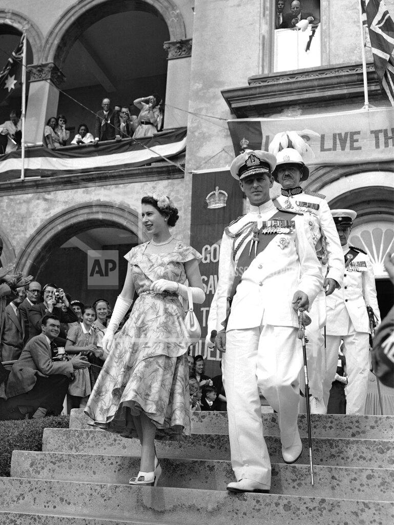 Uncredited FILE - Britain's Queen Elizabeth II and the Duke of Edinburgh leave the House Of Assembly after the Queen had addressed Bermuda's Colonial Parliament, in Hamilton, Bermuda on Nov. 25, 1953. (AP Photo, File)