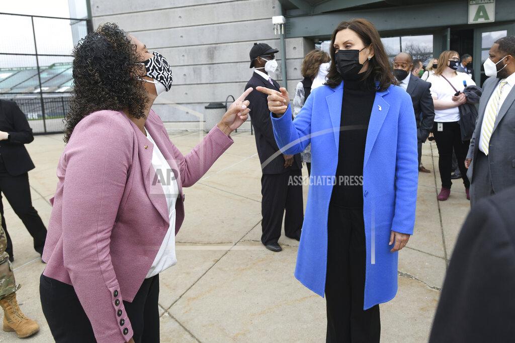 Lon Horwedel Michigan Governor Gretchen Whitmer, right, shares a laugh with State Rep. (District 55) Felicia Brabeck, outside the Eastern Michigan University Convocation Center, Monday, April 12, 2021, where Whitmer and U.S. Rep. Debbie Dingell were visiting with volunteers and local civic leaders at the COVID-19 Vaccination Clinic set up inside the center. (Lon Horwedel/Detroit News via AP)
